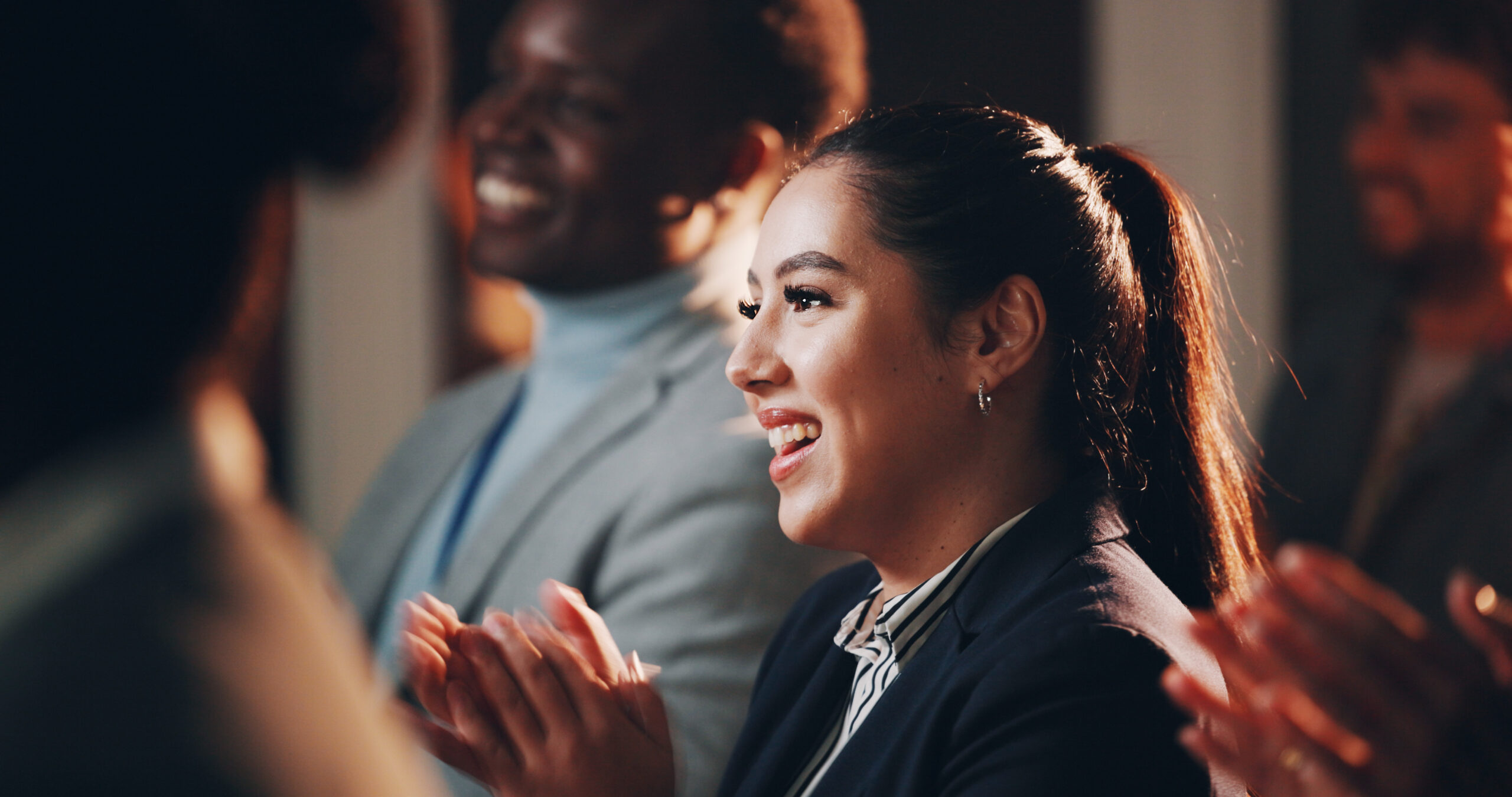 woman-smile-and-applause-in-seminar-for-business-2025-04-06-08-19-20-utc